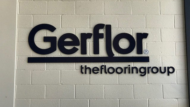 Gerflor the flooring group letters on brick wall
